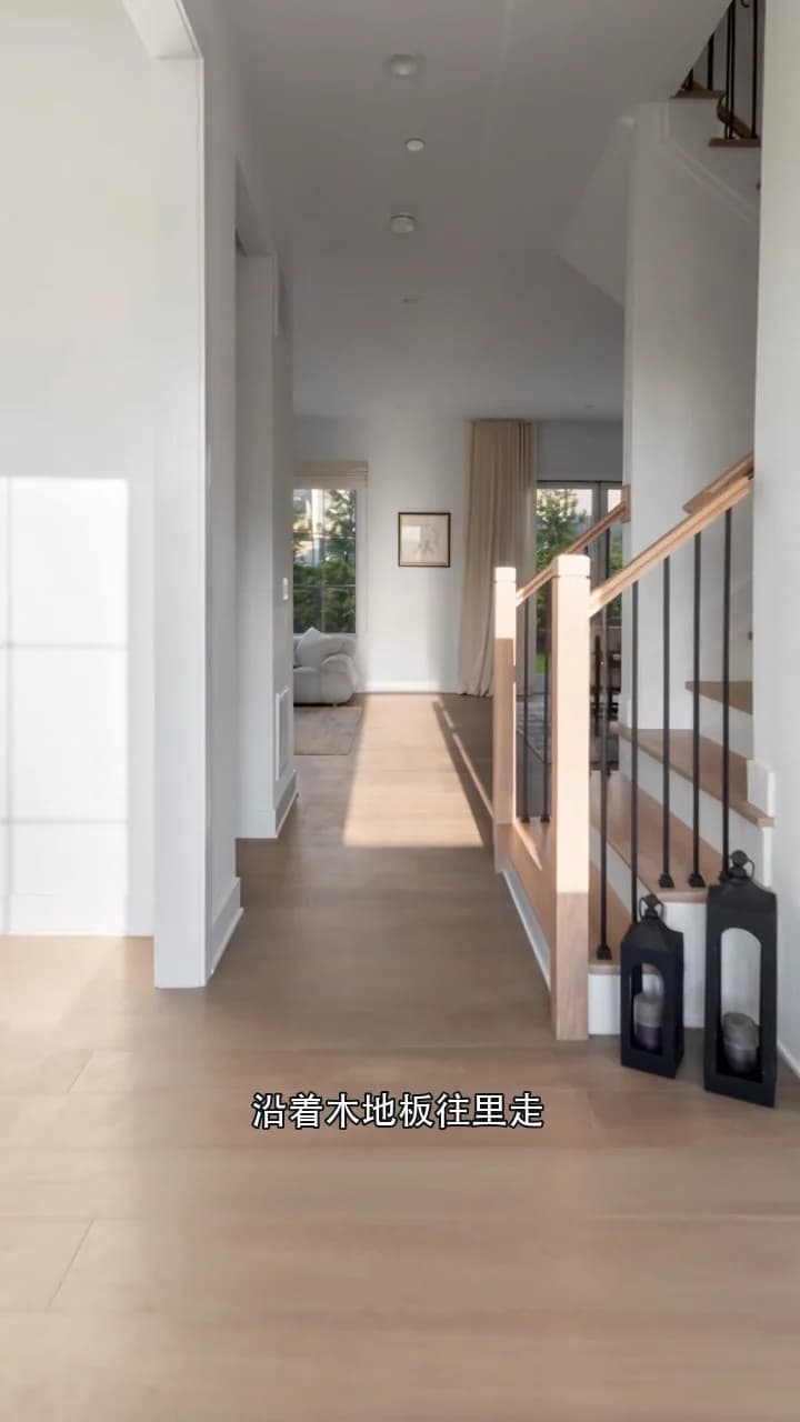 Sunlit entry and staircase at the Sequoia Circle home