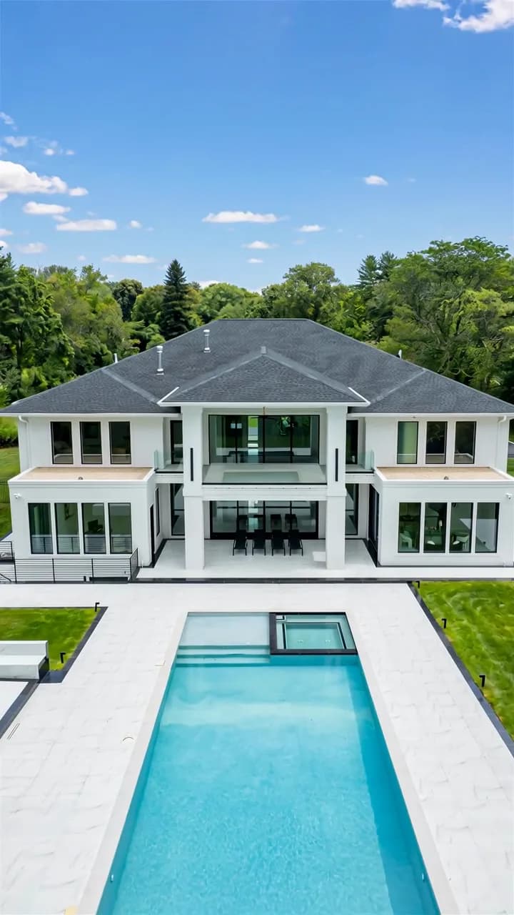 Pool and garden at the Old Brookville estate featured in a property tour
